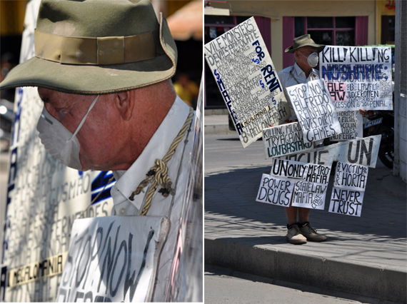 demonstran - pria berpapan di pinggir jalan