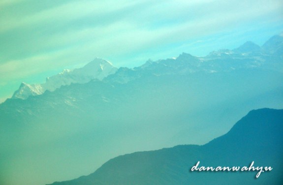 layers of mountains seen from the plane