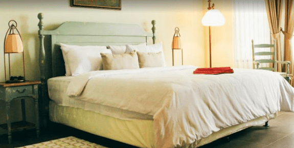 Salah satu kamar di Sandalwood Boutique Hotel